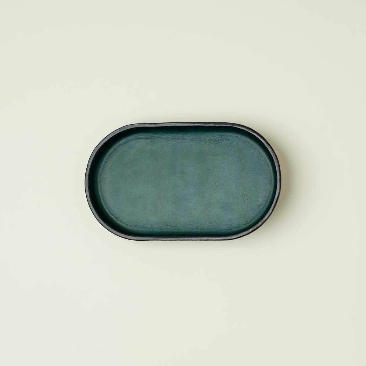 Vessel leather valet tray in deep green, oval form, smooth surface, L'officina di LeRoy, made in LA