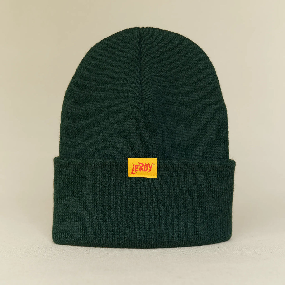 LeRoy cuff beanie in hunter green with woven label in red and orange on yellow, L'officina di LeRoy
