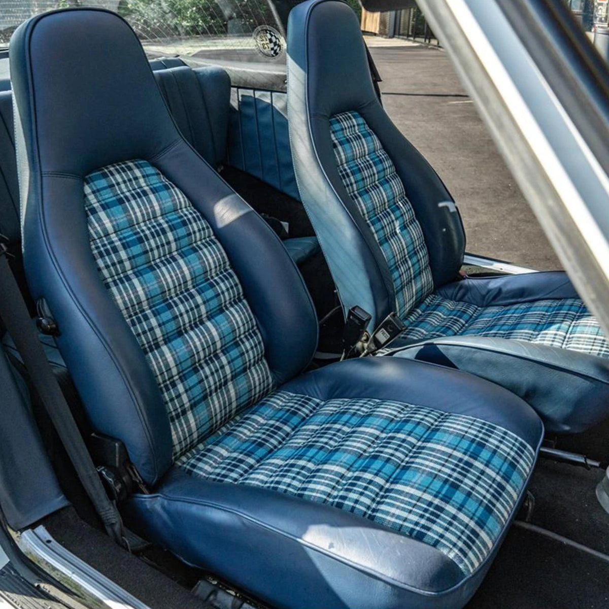 Tartan cushion on a classic car interior, lifestyle reference shot