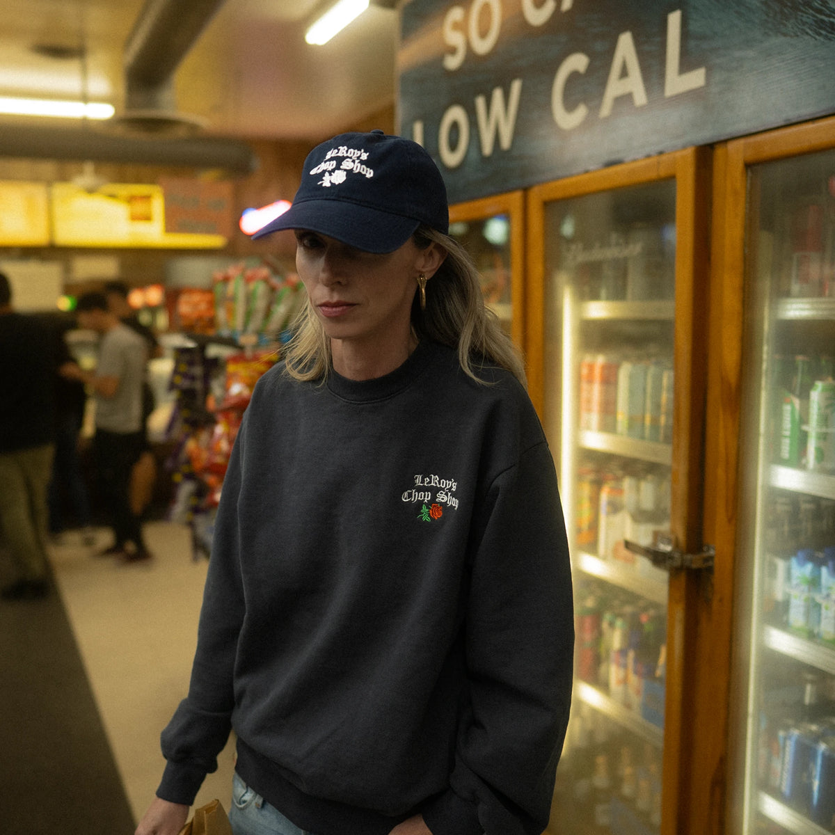 LeRoy's Chop Shop cap alongside crewneck sweatshirt, apparel grouping