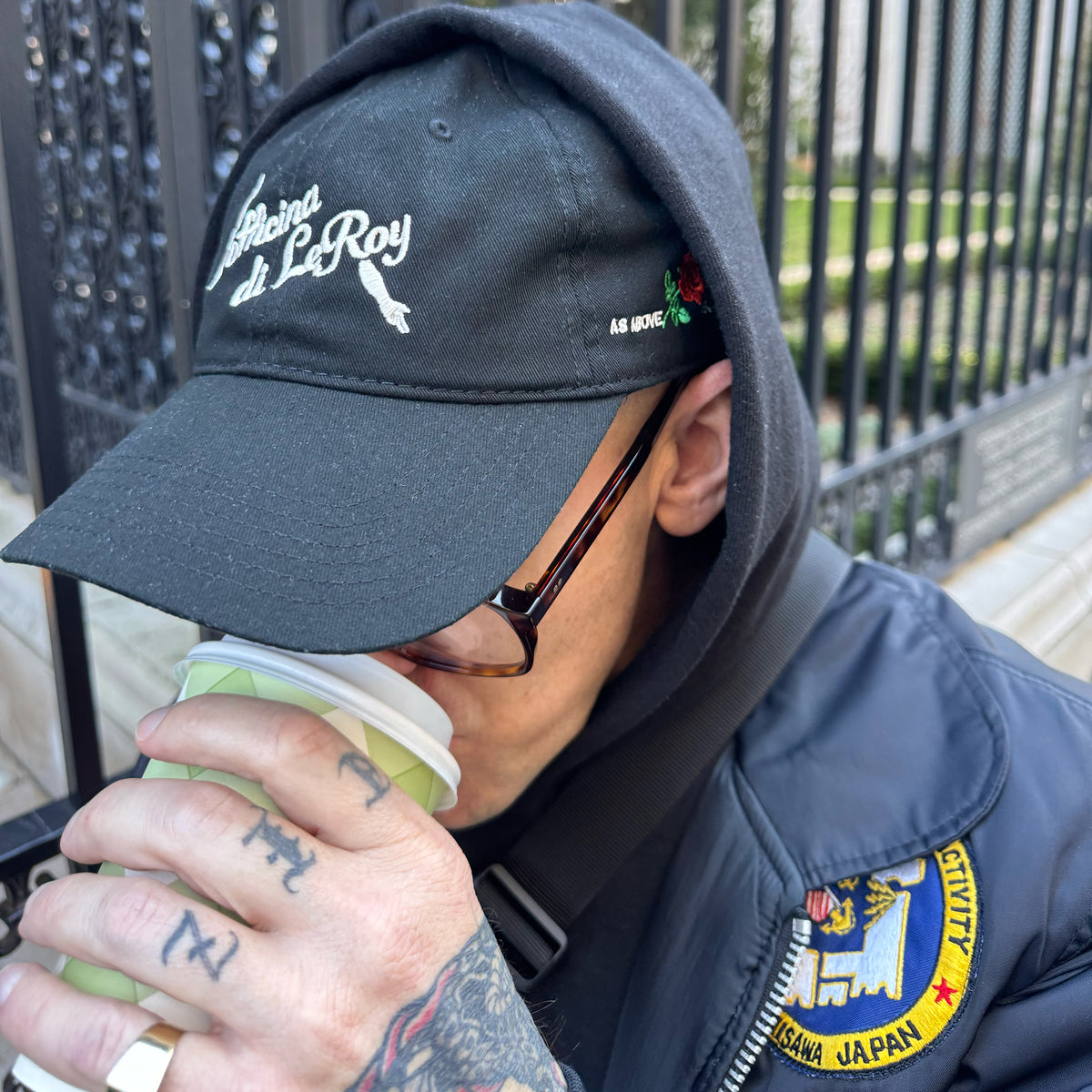 As Above So Below cap worn with a jacket and patch, lifestyle shot