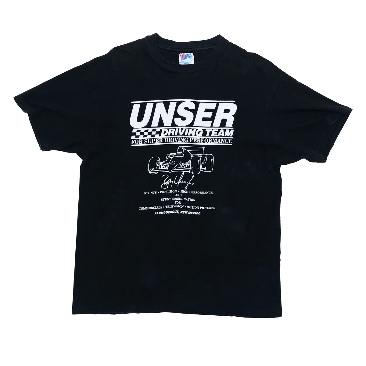 Vintage Unser Driving Team tee in black with white graphic listing stunts, precision driving, and film work, Albuquerque NM, large