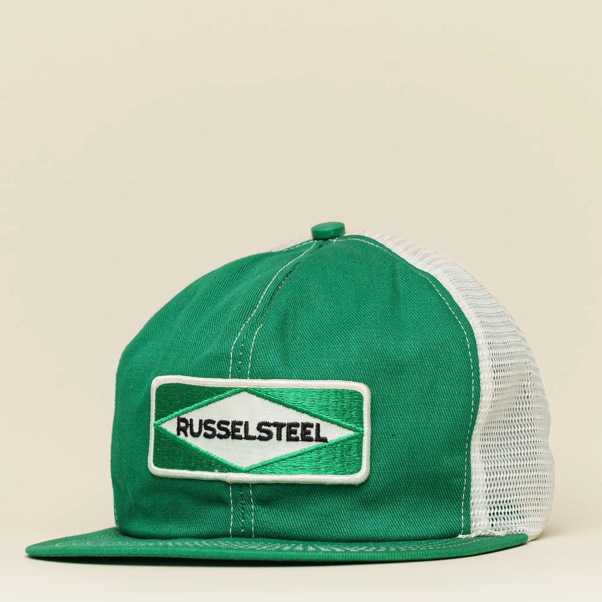 Vintage Russelsteel mesh snapback in green and white with rectangular patch logo