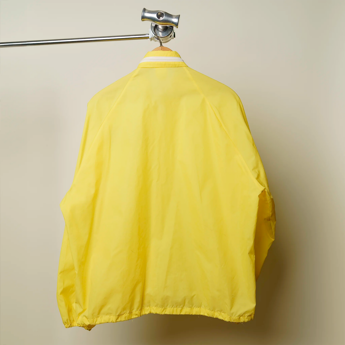 Vintage Martin Cadillac windbreaker chest patch close-up in blue and gold