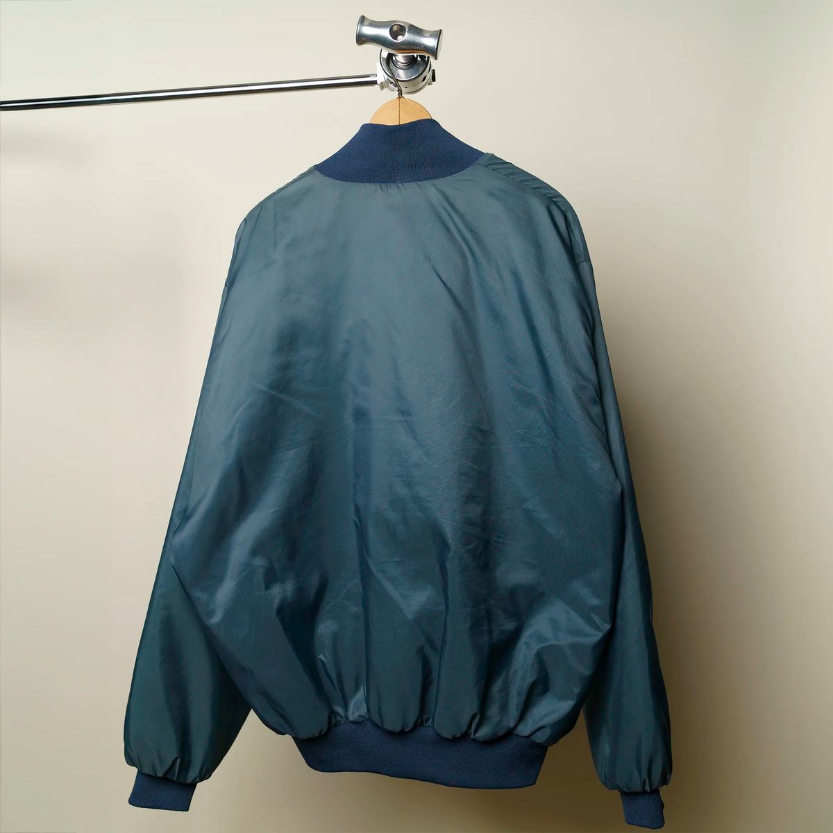 Vintage Amoco bomber jacket back view showing fit and satin construction