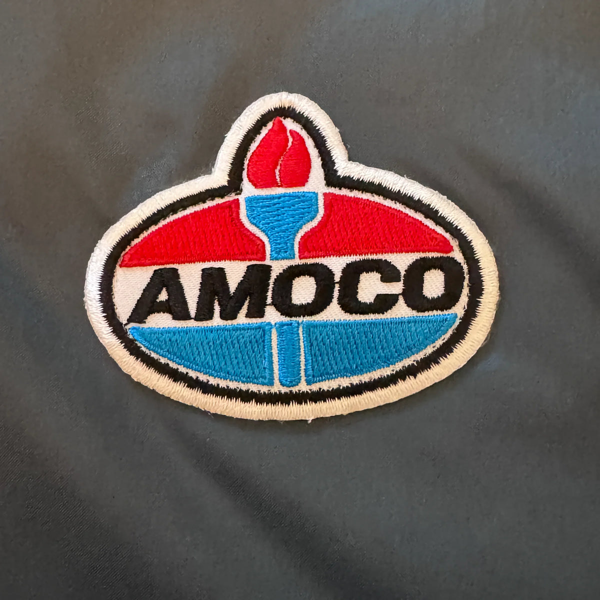 Vintage Amoco bomber chest patch close-up