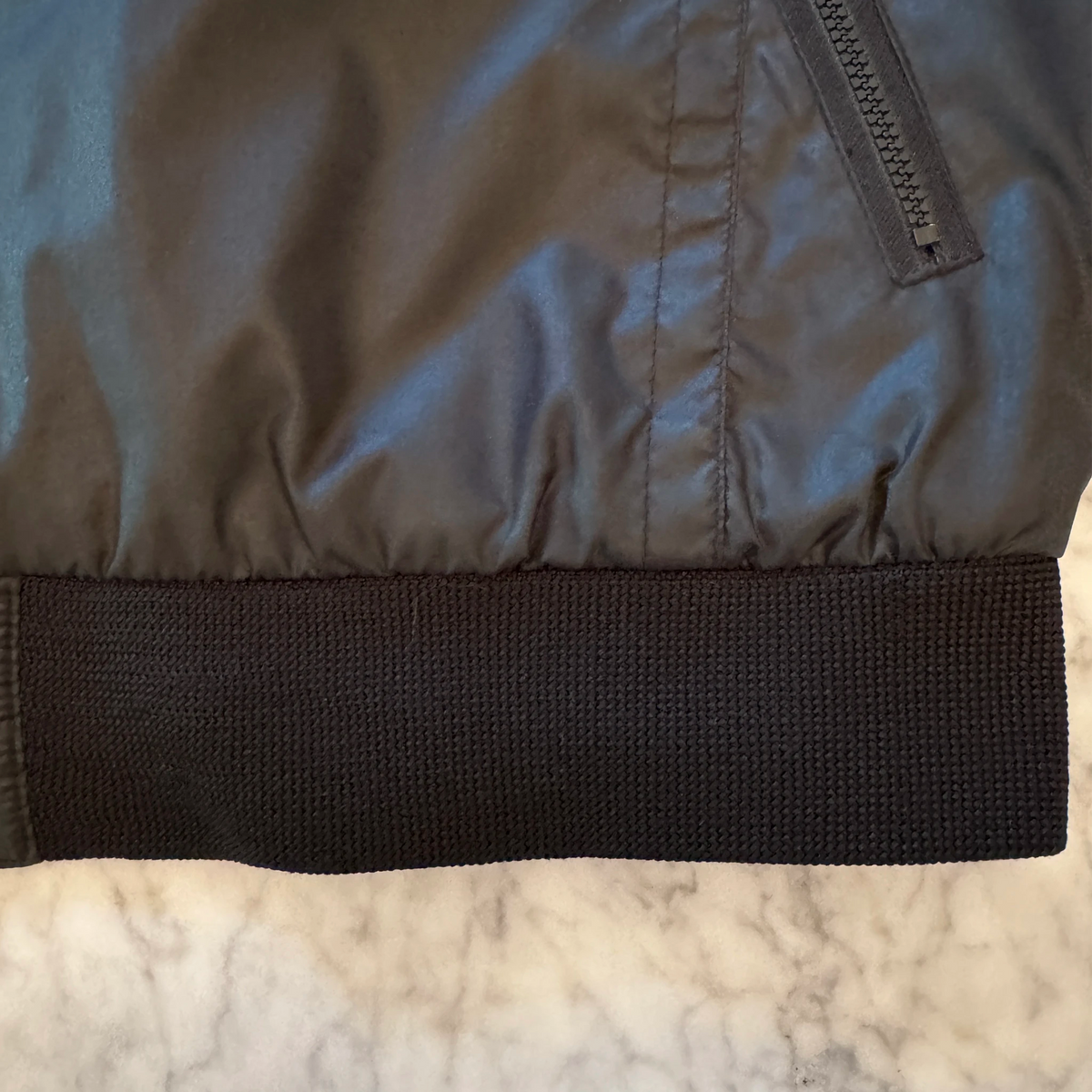 Vintage Castrol GTX jacket laid flat showing front