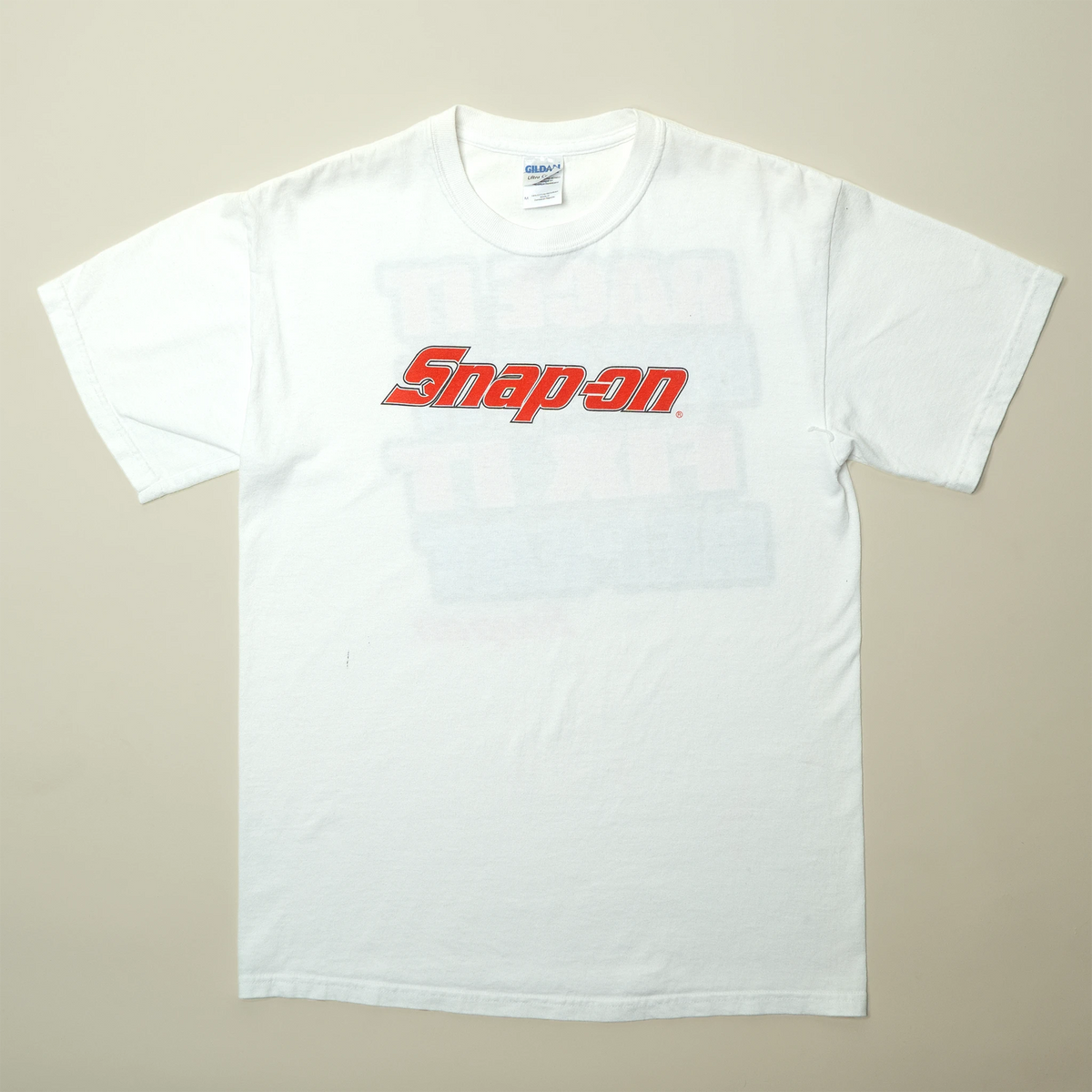 Vintage Snap-on Tools tee in white with red logo on chest, medium