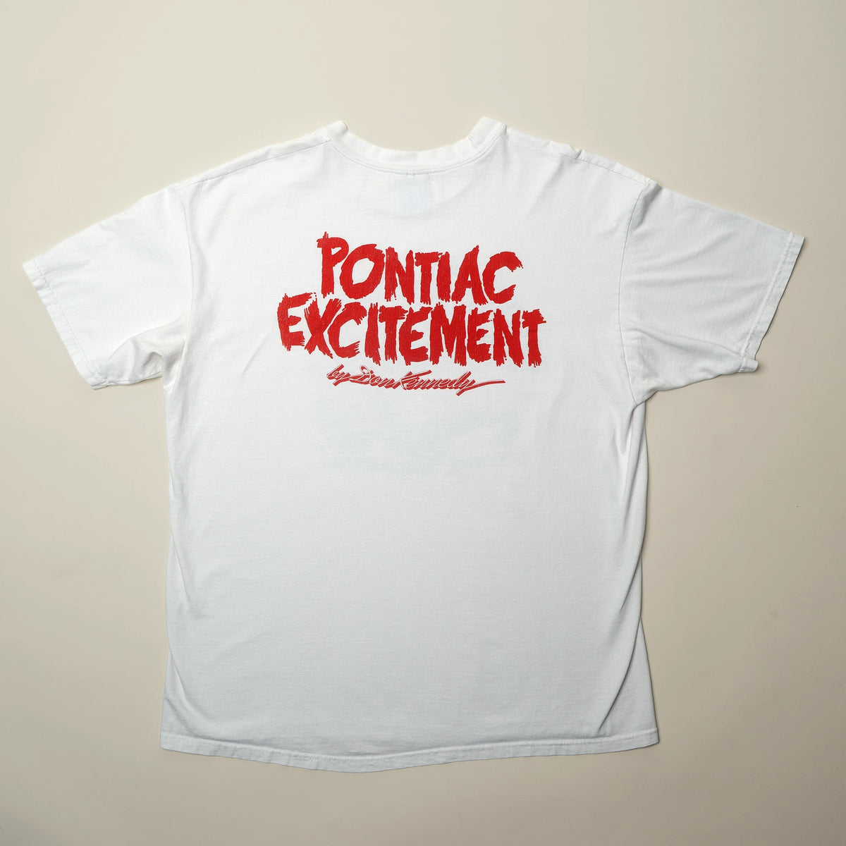Vintage Don Kennedy tee back view showing tag and construction
