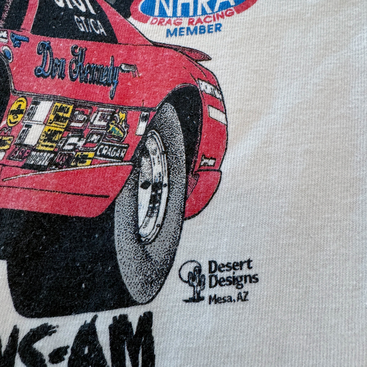 Vintage Don Kennedy tee front graphic close-up showing car and text detail