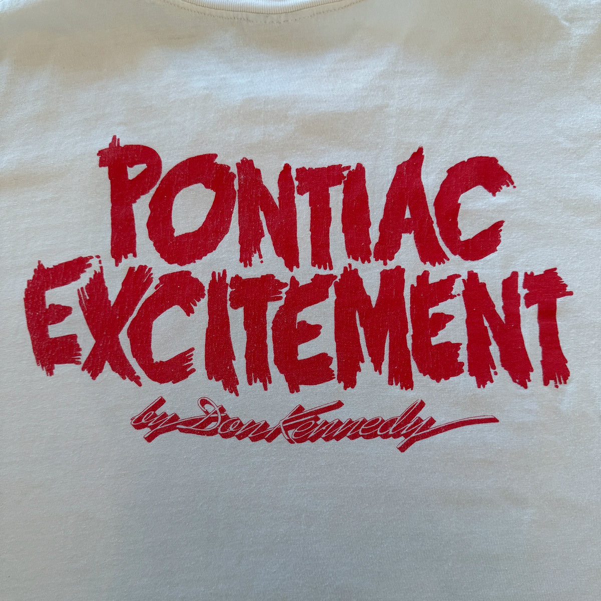Back of vintage Don Kennedy tee showing Pontiac Excitement lettering in red