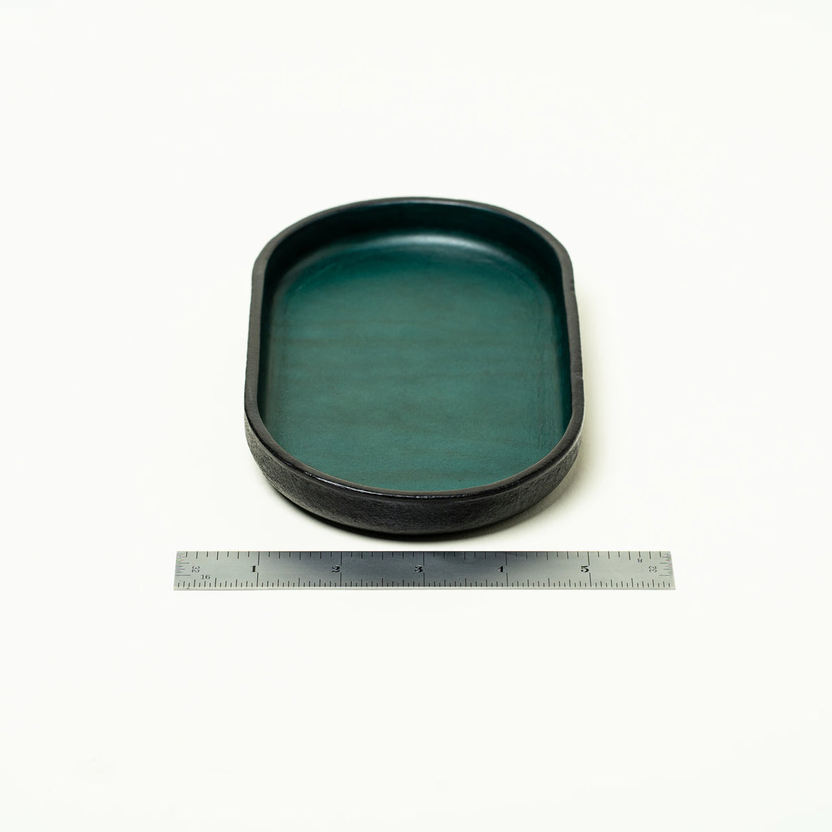 Vessel leather valet tray showing edge detail and oval form