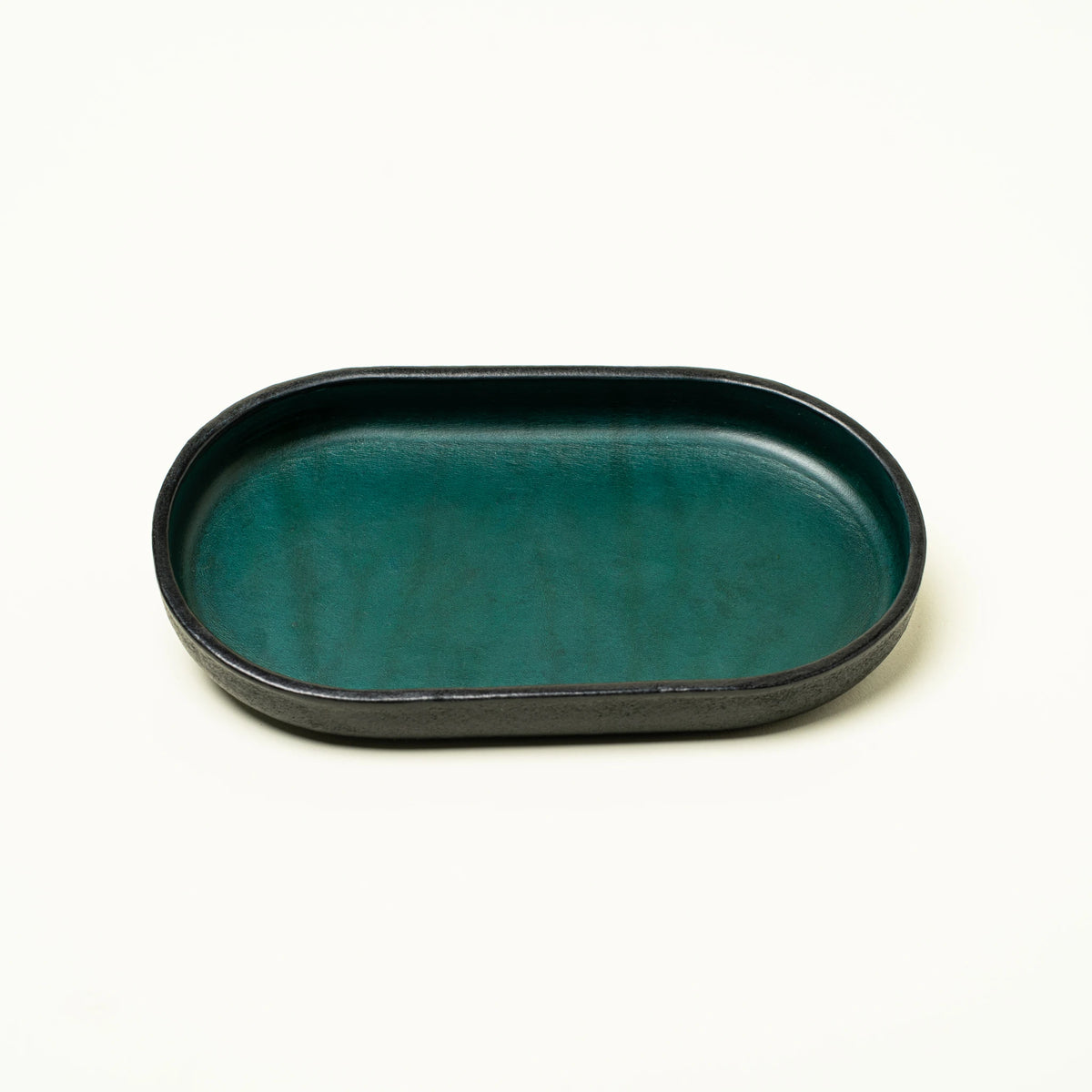 Vessel leather valet tray side profile showing rim height and construction