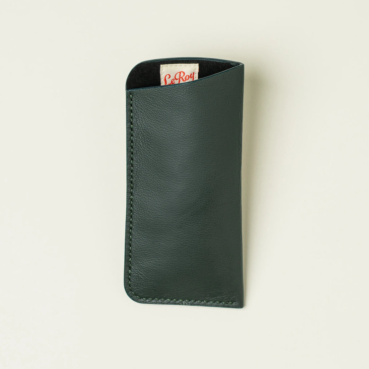 Horus leather glasses sleeve top-down view on a white surface