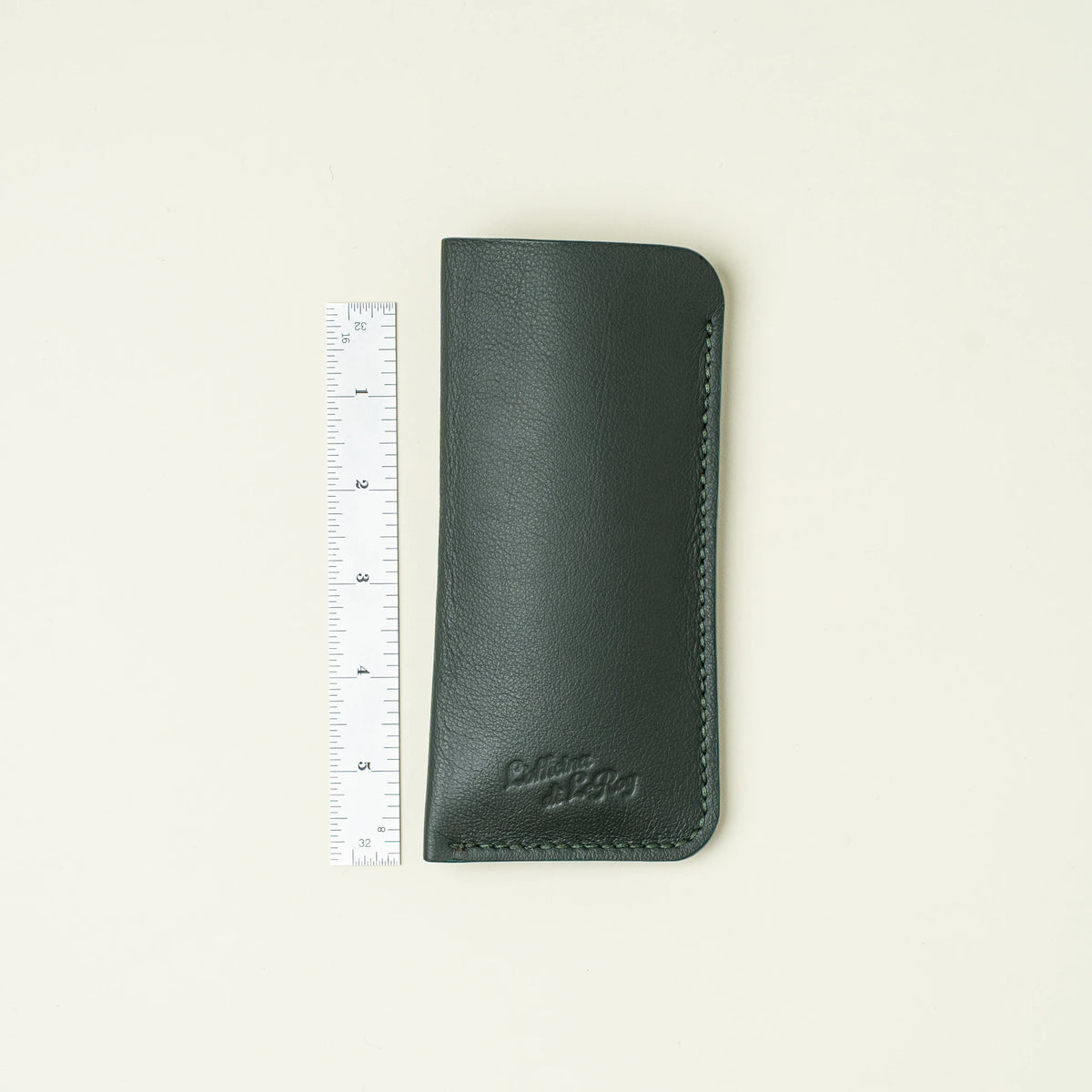 Horus glasses sleeve with ruler for scale, closed on a white surface