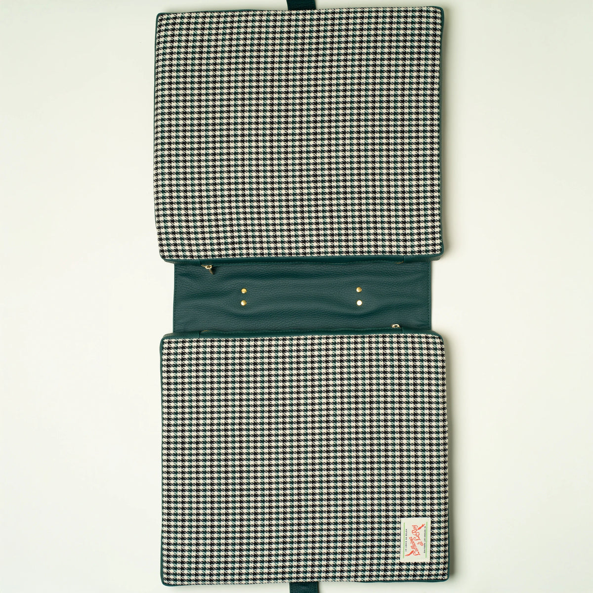 Pepita tailgate cushion reverse side on a beige background