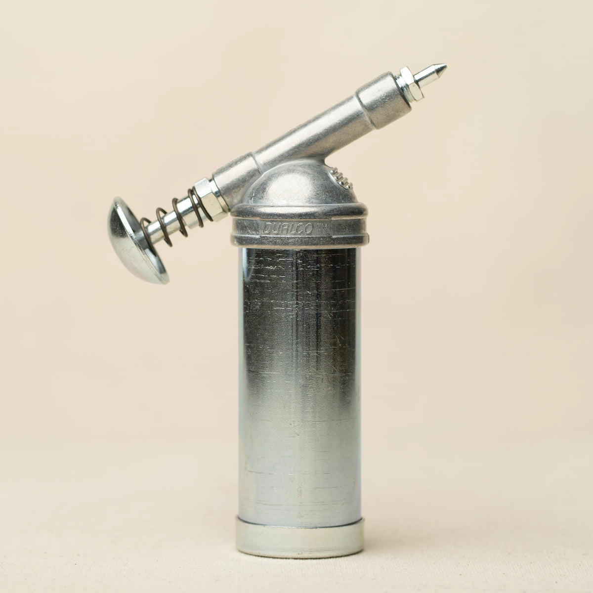 L'officina x Dualco mini grease gun angled view showing full profile