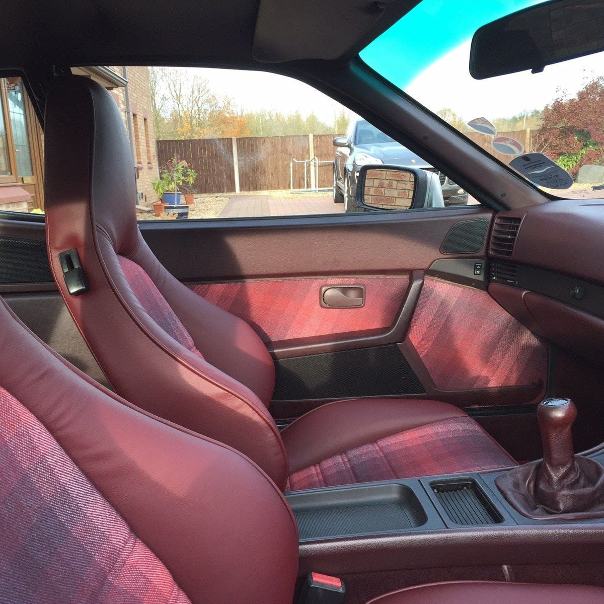 Studio Check cushion shown on a classic car seat, lifestyle reference shot