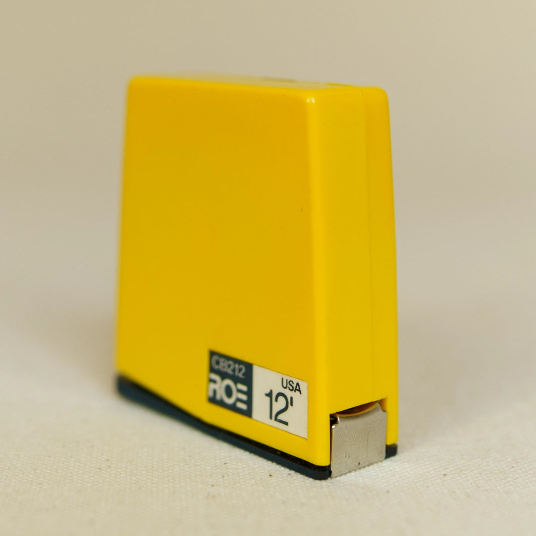Vintage Roe tape measure side view showing case profile