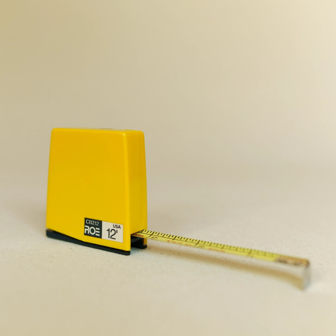 Vintage Roe tape measure back showing belt clip and construction