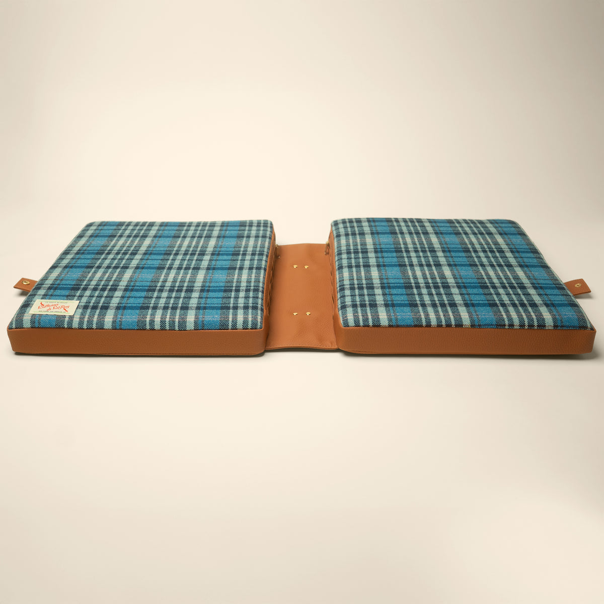 Tartan tailgate cushion in blue plaid with tan field and brown border, L'officina di LeRoy, made in LA