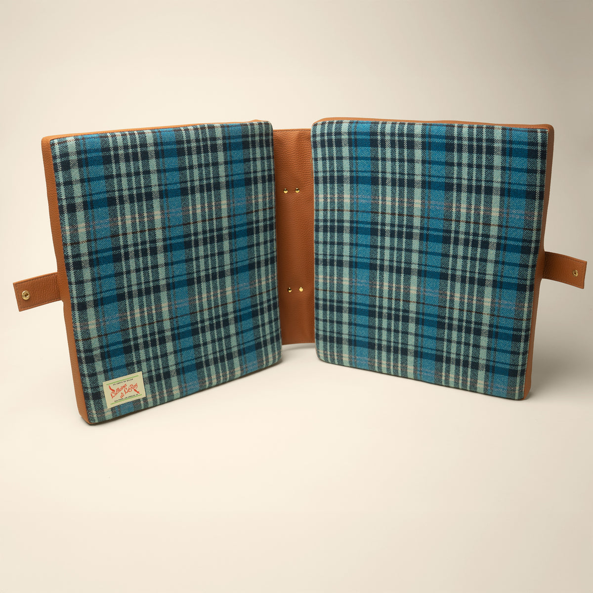 Tartan tailgate cushion side profile on a beige background