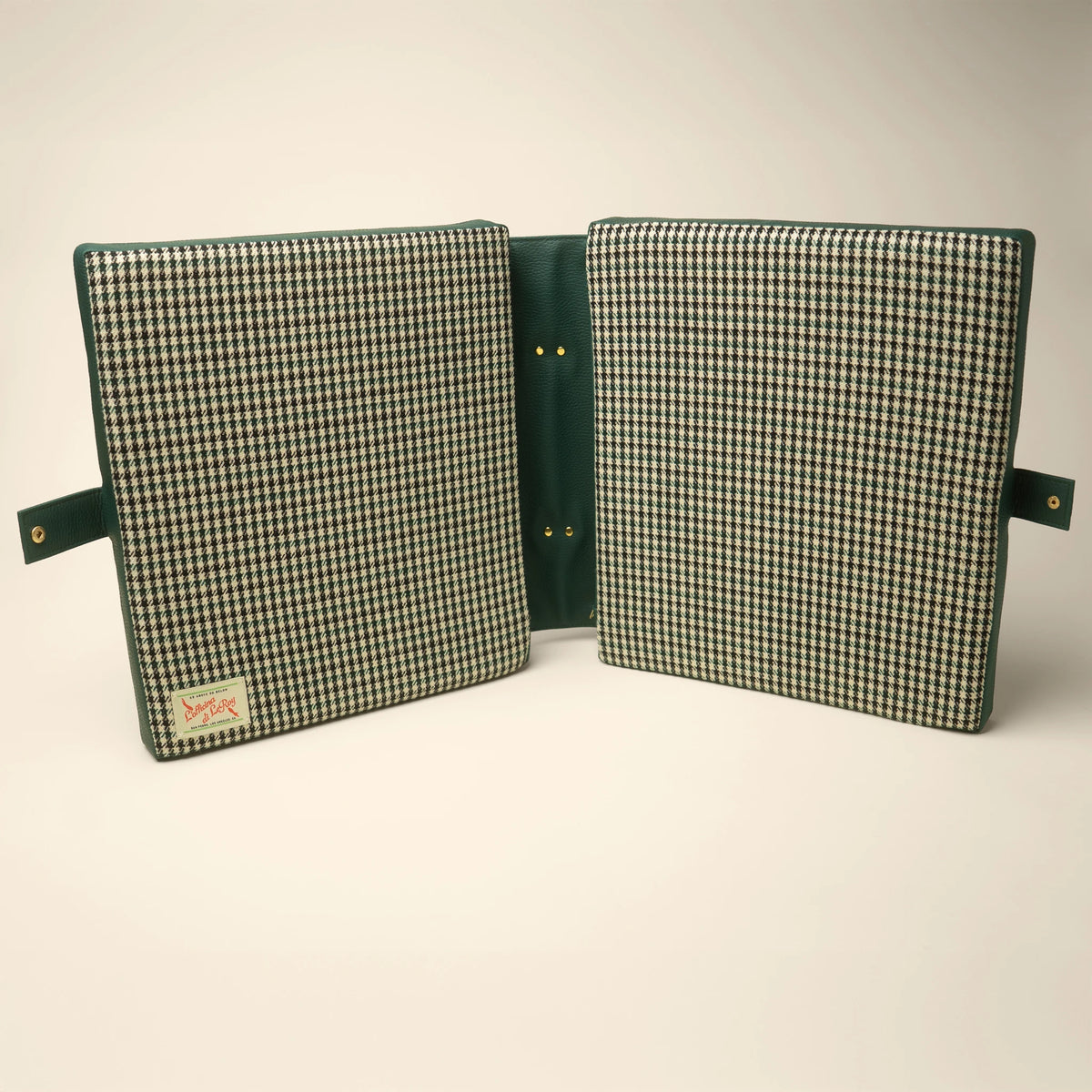 Pepita tailgate cushion side view on a beige background