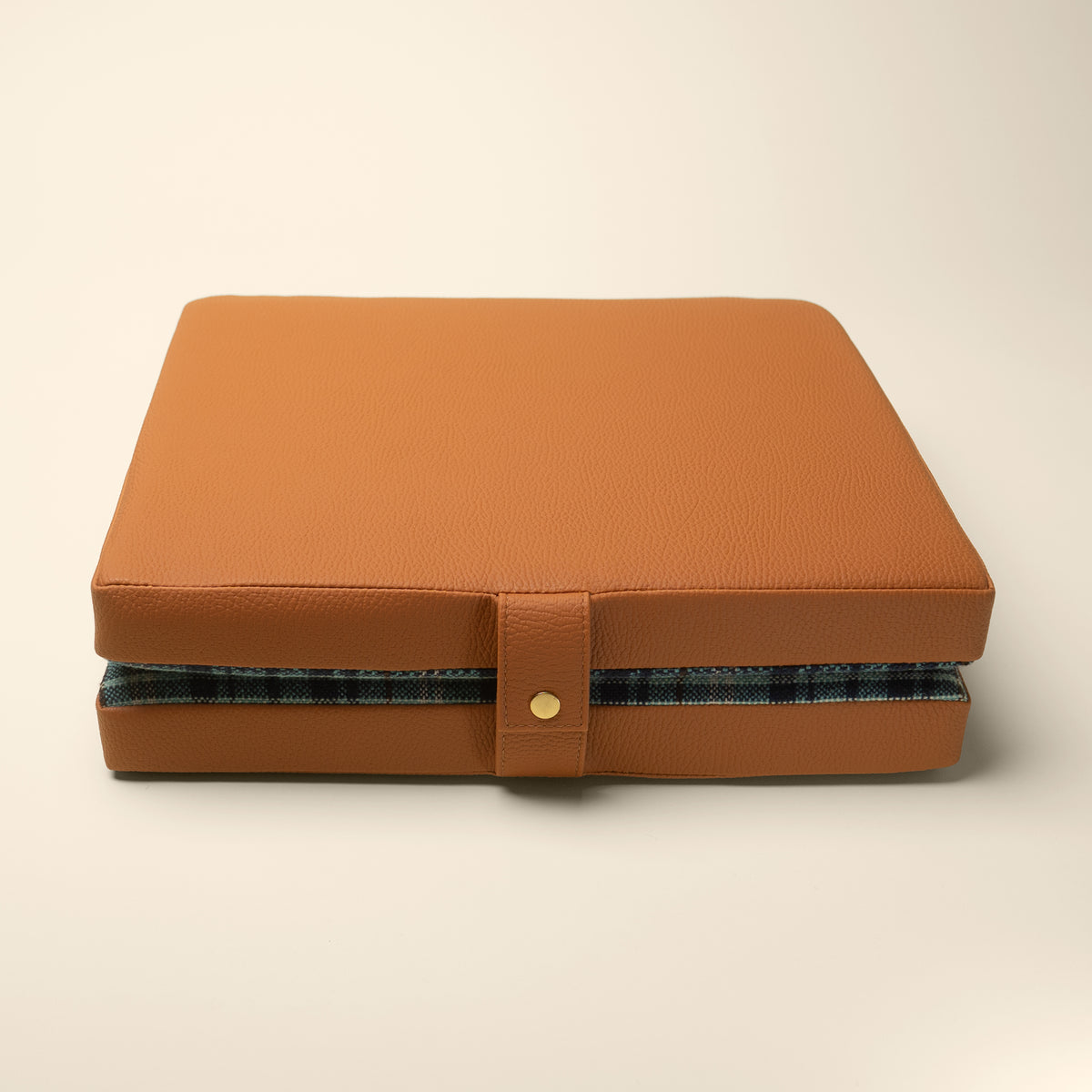 Tartan tailgate cushion angled view showing thickness